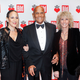Gina Belafonte with her father, Harry Belafonte, and his wife, Pamela Frank, at the Ein Herz fuer Kinder Gala 2014 at Tempelhof Airport on Dec. 6, 2014, in Berlin (Isa Foltin/Getty Images)